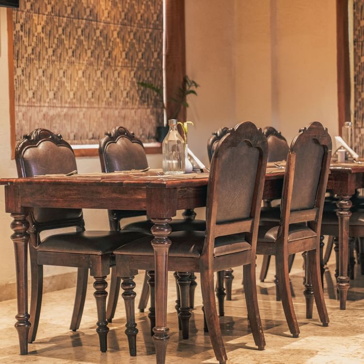Image of table and chairs arranged neatly in a dining space